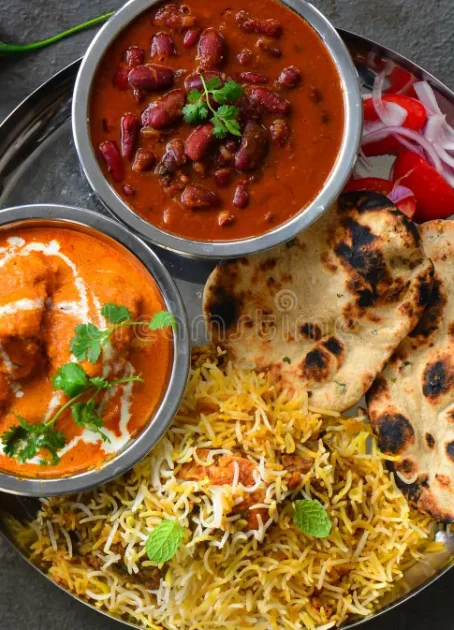 north-indian-party-meal-punjabi-non-vegetarian-thali-indian-thaali-meal-butter-chicken-rajma-masala-chicken-biryani-tandoori-112712610